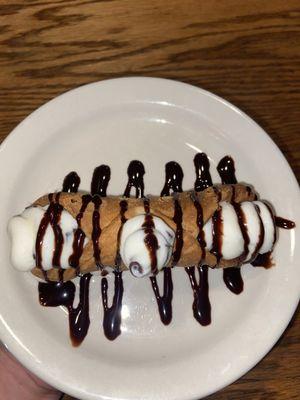 Cannoli with chocolate syrup