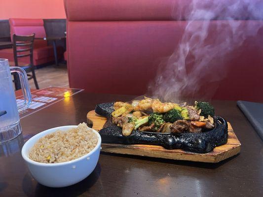 Golden bowl sizzling with fried rice