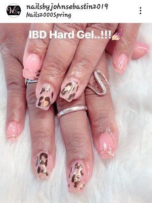 Ladies you will love IBD Hard Gel it lasts 4 t weeks or more .John is the best he can master any design you want .