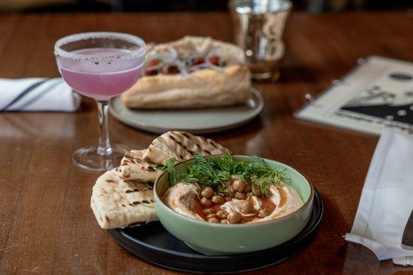 Table setting with Lavendar Gimlet and hummus