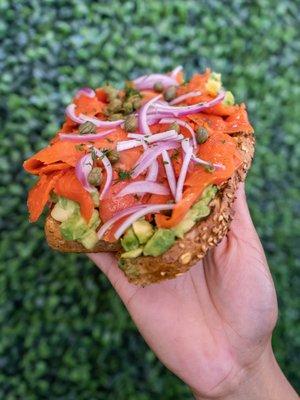 Santa Barbara Toast - piled high with smoked salmon, avocado, fresh dill, capers, and red onions.