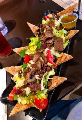 Large Gyros Salad with wheat pita bread.