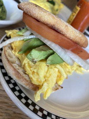 Menu hack: turned sides into a breakfast sandwich! (Scrambled eggs with cheddar, English muffin, avocado, tomato, onion)