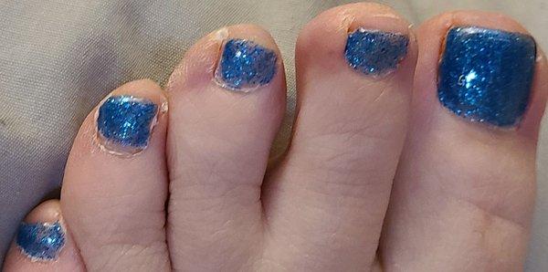 Left foot gel pedicure close up