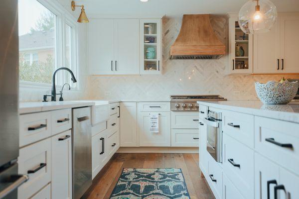 Farmhouse style kitchen remodel in Great Falls, VA with a signature kitchen island