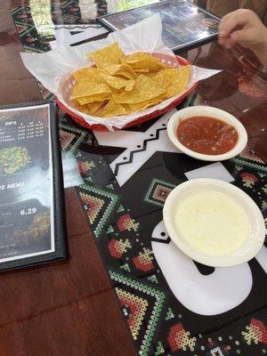 Complimentary Warm corn chips, salsa and warm cheese dip