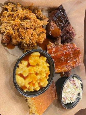 3 meat platter (pulled chicken, baby back ribs, and lean beef brisket) with Mac-n-cheese and cole slaw.