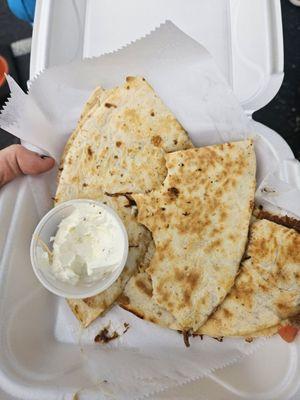 Carnita quesadilla with sour cream