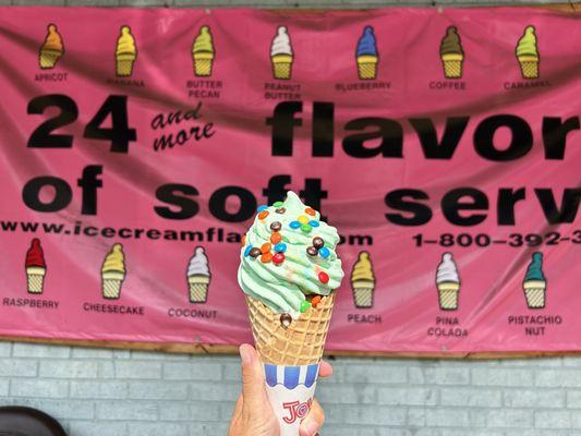 Two scoops soft serve- root beer and pistachio with mini M&Ms