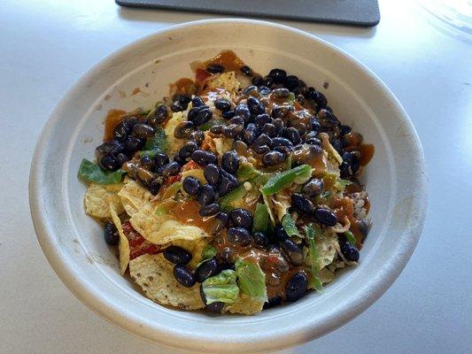 Pork grain bowl with beans, chips, hot peppers, and jalapeño.  Love the chipotle sauce.  Also the jalapeño crema, not pictured. [GF]