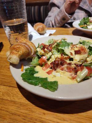 Cinnamon butter croissant and side salad with hot bacon dressing and honey mustard