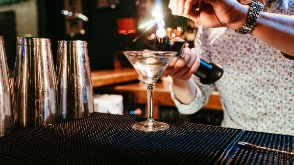 Fire up the night with a Vesper Martini, the James Bond Classic! We serve ours stirred. 
 
 Photo by Joy Waters