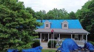 Crews carefully covered my outdoor furniture and shrubs