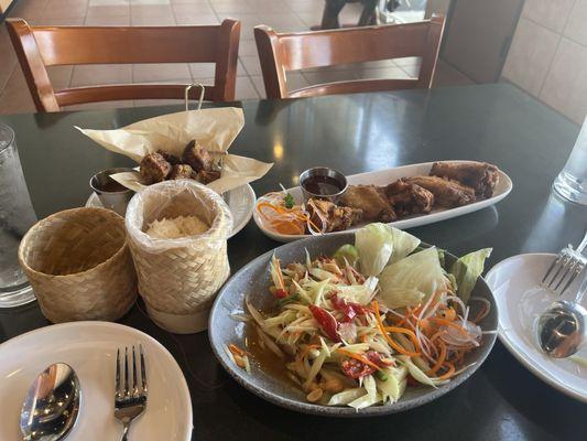 Papaya Salad, Garlic Wings, Thai Baby Spare Ribs and Stick Rice.