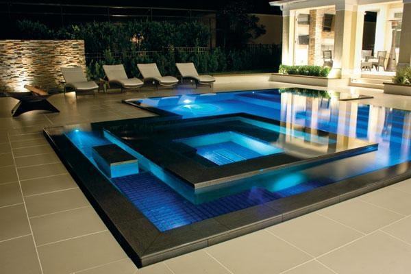 Contemporary Zero edge design. Granite, Led lighting, clean lines, beautiful backyard setting.