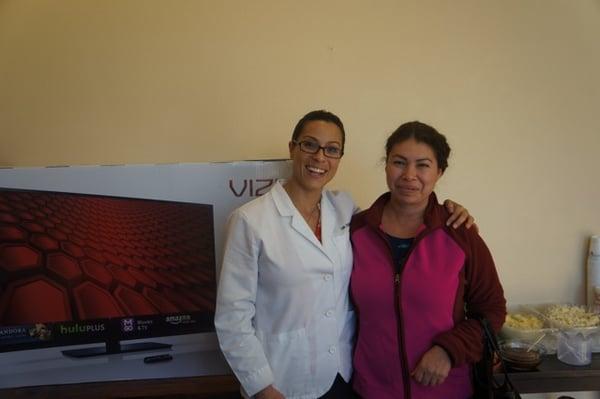 Dr. Farrell and one of the Patient Appreciation Day winners of a 50" screen TV.