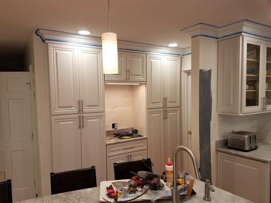 Built-in pantries with desk and under cabinet lighting