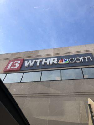 WTHR sign on building.