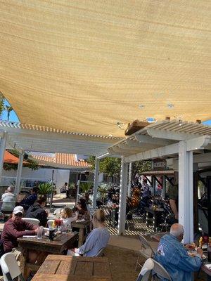 Outdoor area with live band playing.