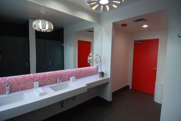 Beautiful bathrooms with showers and all of the amenities to clean up after a sweaty workout.