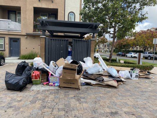 Piled trash creating pollution for our community.