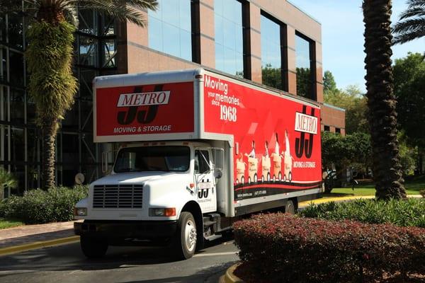 Picture of a J&J Metro Moving and Storage truck outside of office building during a move in Longwood, Florida.