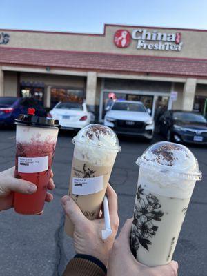 Strawberry fruit tea with cheese foam, black milk tea with cream, green milk tea with cream