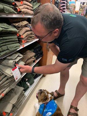 Althea helping daddy shop for his work clothes.