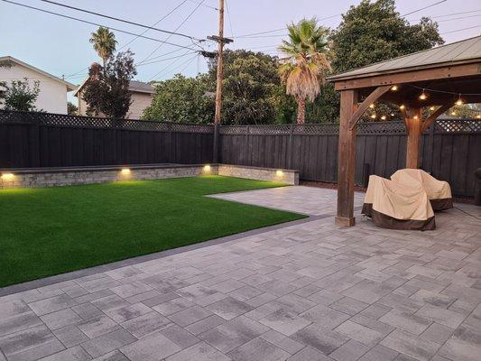 Pavers and turf combo from Outertainments, with our existing pergola.