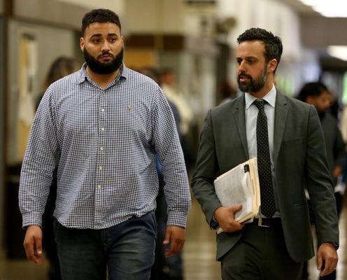 Seth Morris walking into court with a client who had all of his charges dismissed