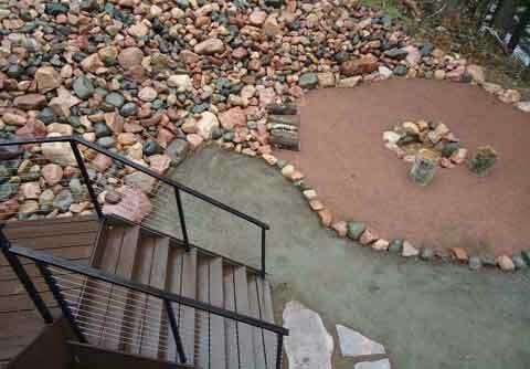 hardscape walkway with a fire pit