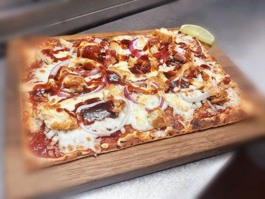 BBQ Chicken Flatbread Pizza, mozzarella, pepper jack cheese, red onions, jalapenos and garnish of lime