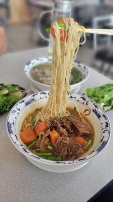 Mi Bo Kho, at least here you can have rice noodle, egg noodle or bread options. Much better than pho Saigon