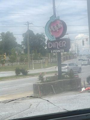 Pops diner is amazing this is the sign outside the resturant it's an 80s style diner that's delicious!