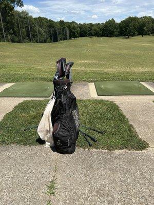 Driving range with golf bag