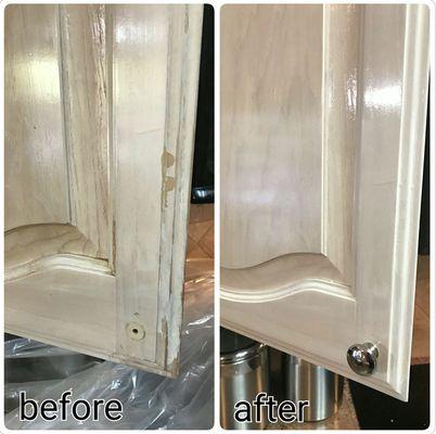 Kitchen cabinet wear and tear around the handle areas.