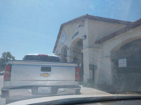 Drive "thru" line waiting for weekly food box pickup.