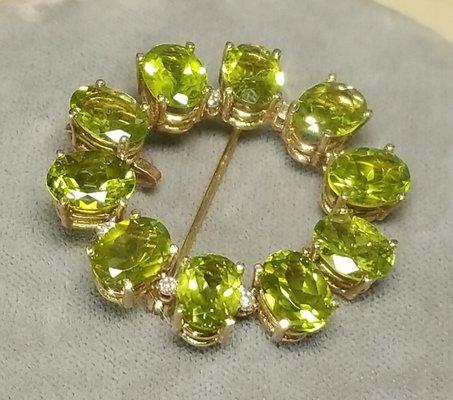 14 karat yellow gold peridot and diamond pendant brooch. www.lisajjewelers