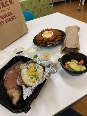 12 oz prime rib, loaded backed potato, seasoned veggies, bread, bloomin onion