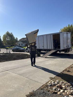 Never seen anyone carry a whole couch on their own. Just wow!