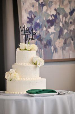 Delicious white cake + whipped cream frosting wedding cake from the Half Moon Bay Bakery