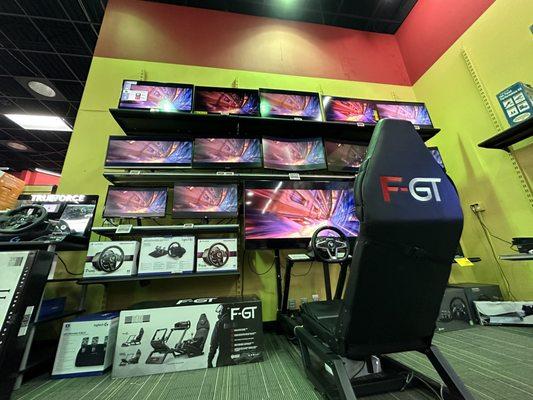 Image showcasing two demos found within the store. Demo different computer monitors while using the racing simulator