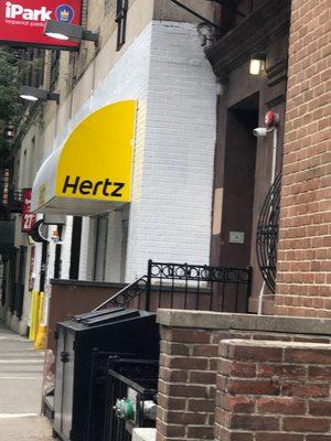 Cute Hertz awning, disastrous service.