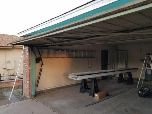 Remove solid one piece garage door and replace with a sectional door