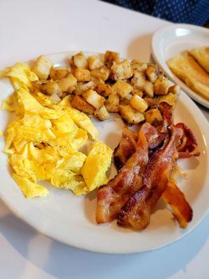 Eggs, bacon & home fries.