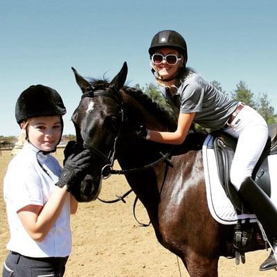 Student Jordan with rescue mare Jazzy and trainer Meg warming her up for her 1st big show:))