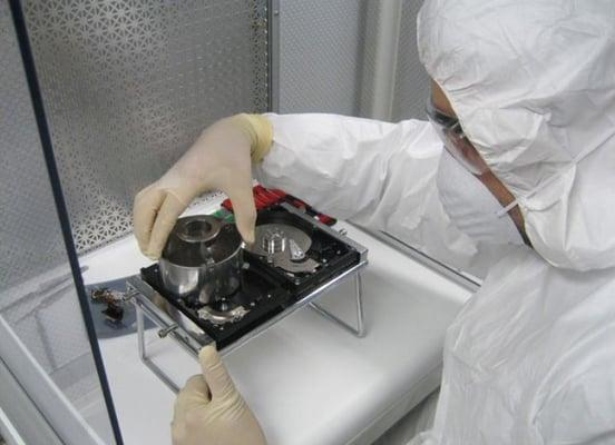 Proven Data Recovery in Washington DC clean room lab technician disassembling hard drive.