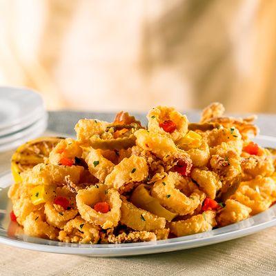 Pan-Fried Calamari with Hot Cherry Peppers – Our signature appetizer - crisp and golden with a fiery flavor.