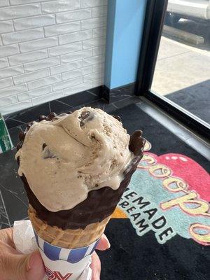 Peanut butter ice cream in a chocolate chip cone