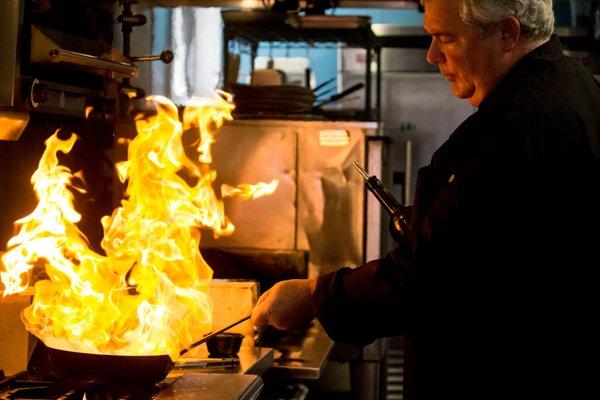 Chef sautéing mussels